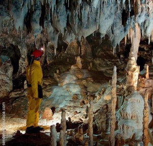 Speleologist inside a cave